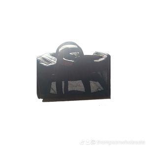 A black and brown dog bag carrier small dog